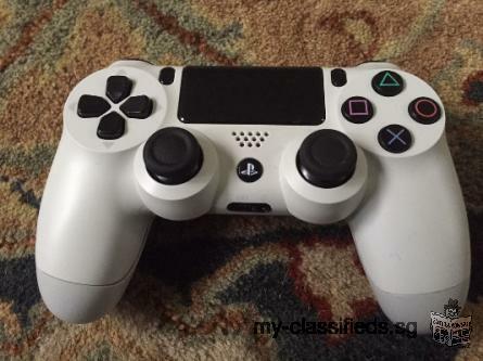White PS4 with 2 games and extra controller